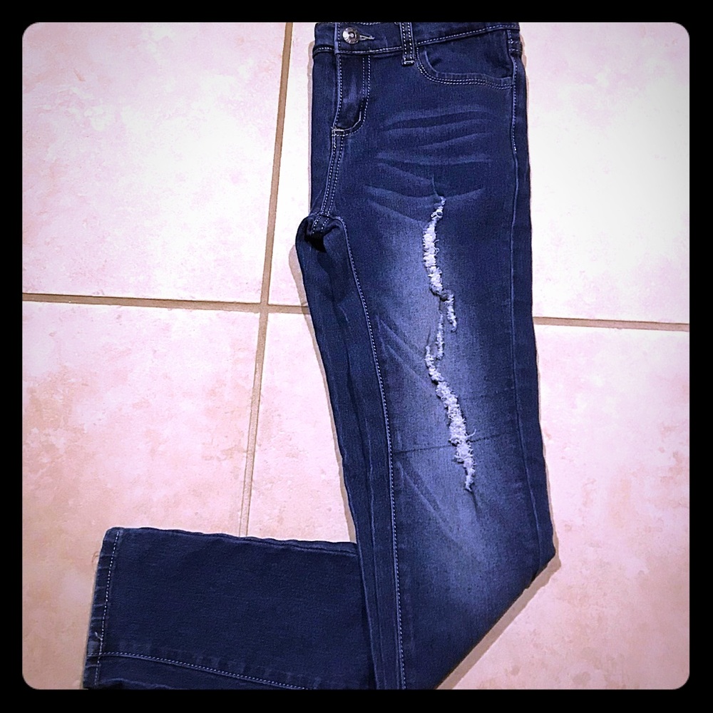 A pair of rip jeans